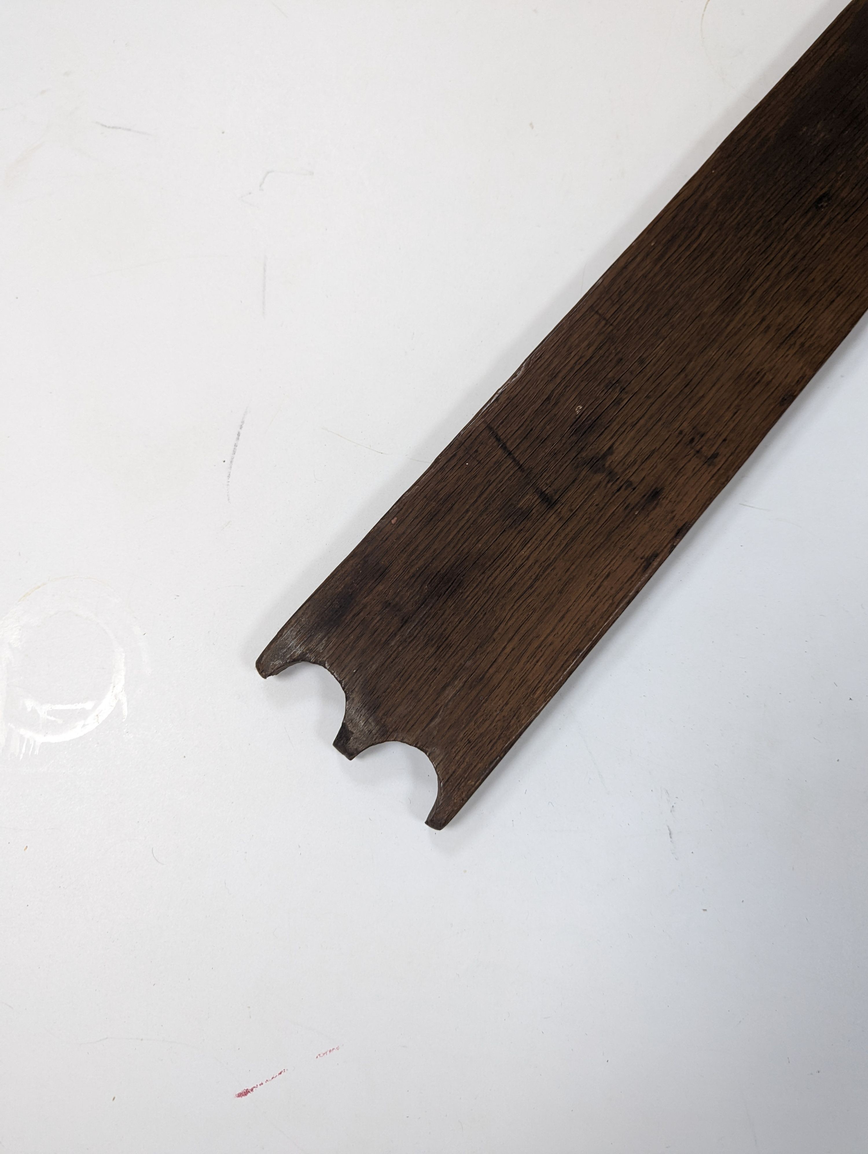 An 18th century Norwegian chip carved oak mangle board, dated 1730, 77cm